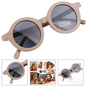 Dinossi – Nachhaltige braune runde Kindersonnenbrille 